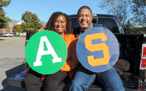 Admin holding an A and S sign